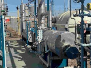 H₂S scrubbing process equipment with industrial piping, pressure vessels, and gas treatment system at an oil and gas facility.