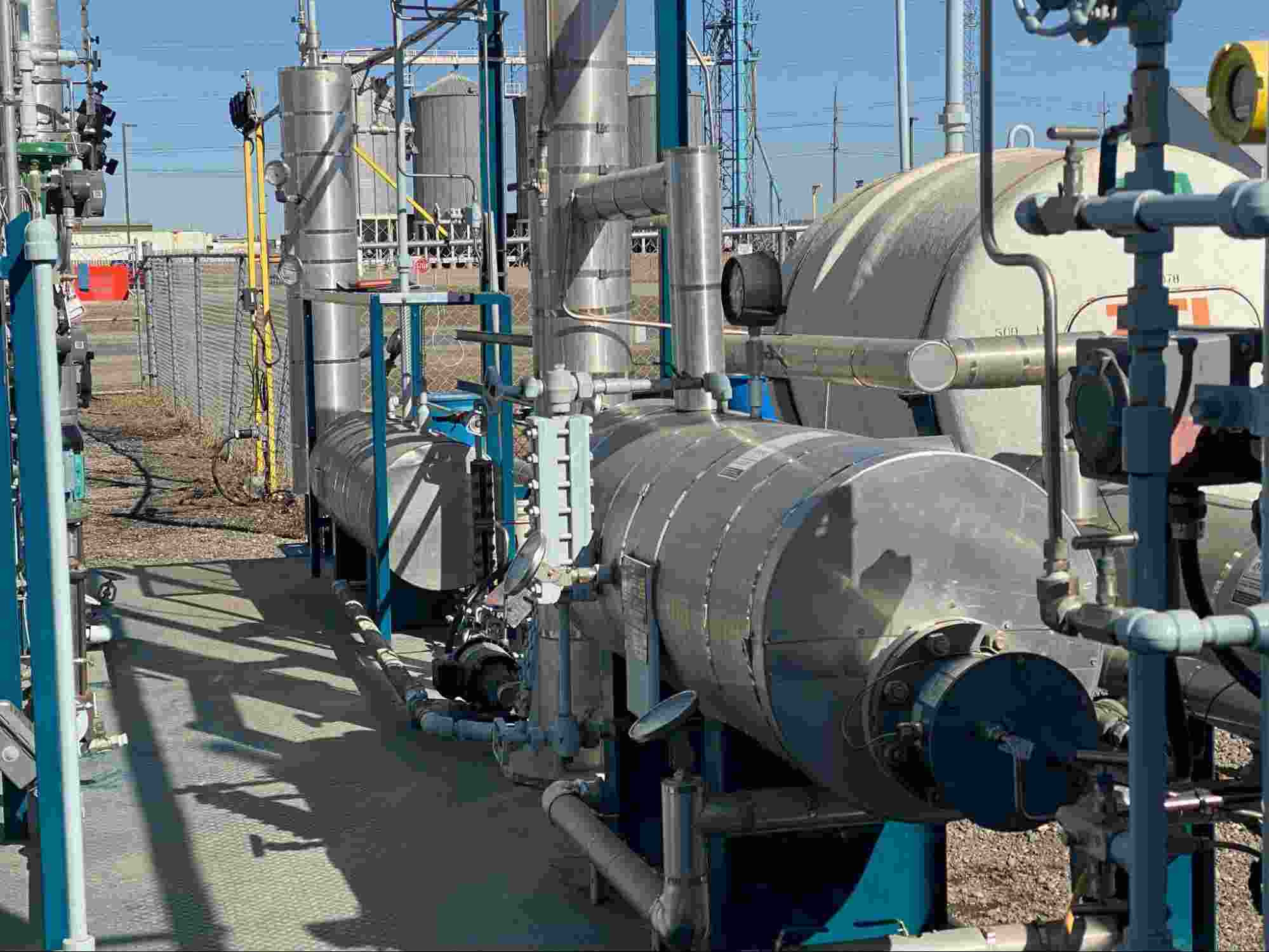 H₂S scrubbing process equipment with industrial piping, pressure vessels, and gas treatment system at an oil and gas facility.