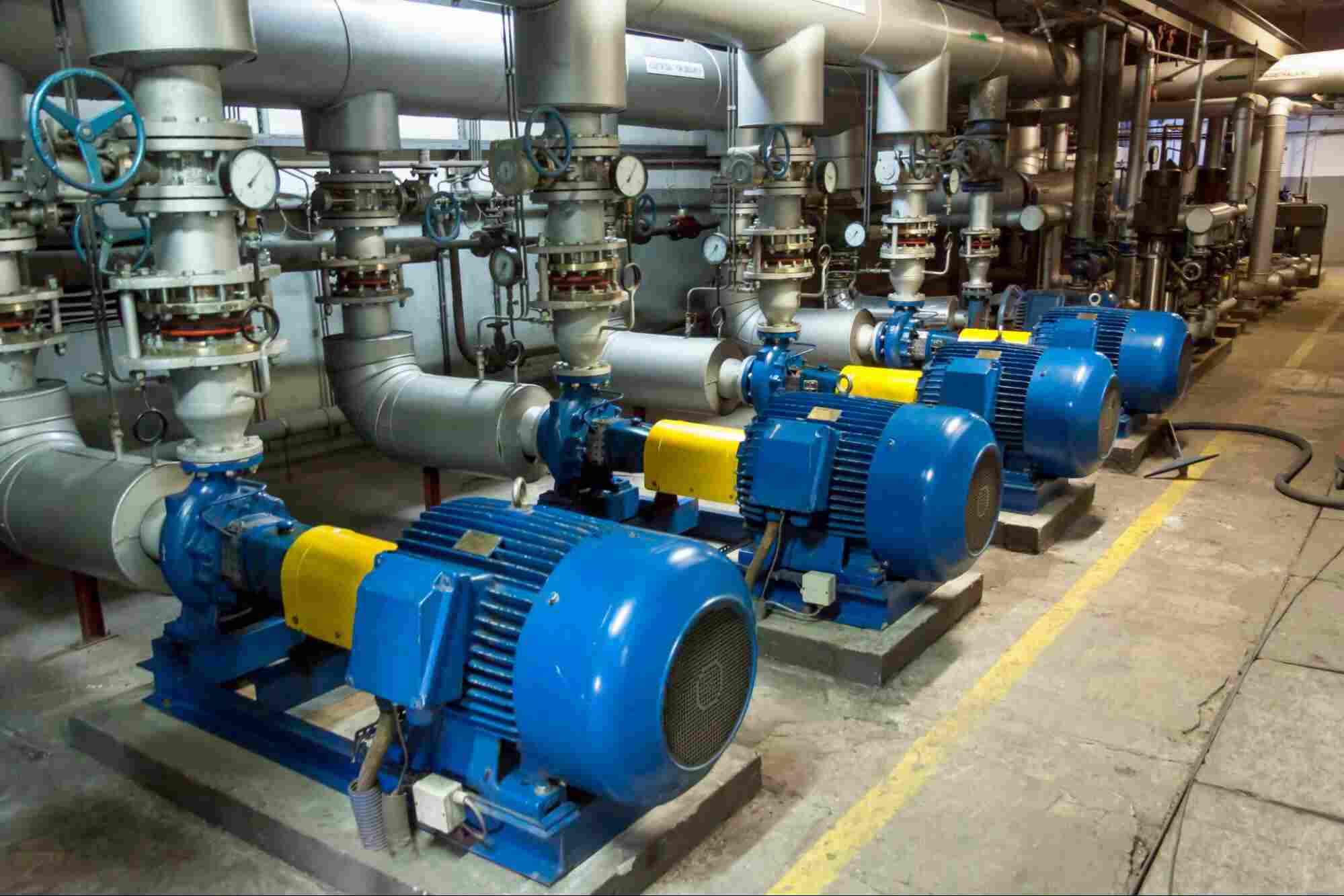 Industrial chemical injection pumps and process piping used with H₂S scavengers in an oil and gas treatment facility.
