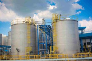 Industrial storage tanks and piping used to manage tank vent emissions.